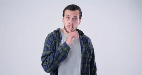 Man gesturing with finger on his lips in slow motion Stock Footage 143942212