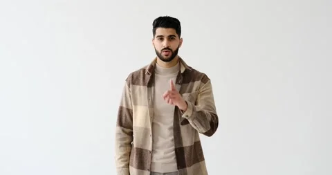 Man gesturing with finger on lips Video stock 196075819