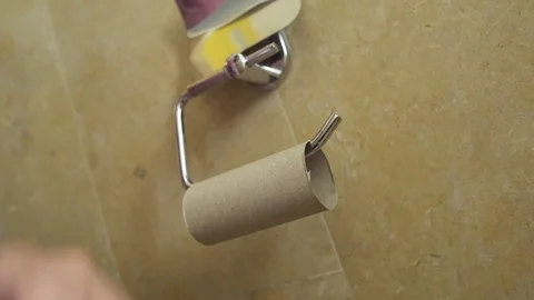 Man get angry and makes a fist - no toilet paper is left Video stock 82312645