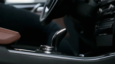 A man gets into a car, leather interior. Without a face. View from the salon Stock Footage 166166569