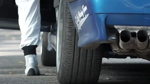 Man gets into the car rally Stock Footage 67209472