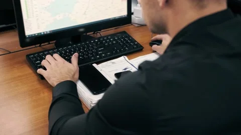 Man gets directions on the map using computer. Office worker during work Video stock 197028906