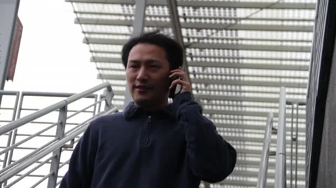 Man gets down staircase by suing phone Stock Footage 36155792