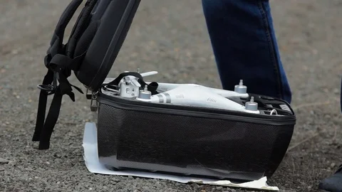 Man gets the drone from the case. Stock Footage 69959758