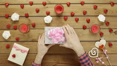 Man gets empty box as holiday gift, top view Stock Footage 87975047