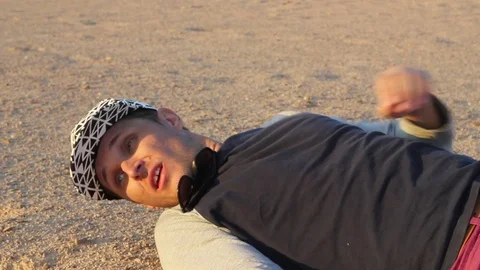 A man gets up off the ground Stock Footage 82588303