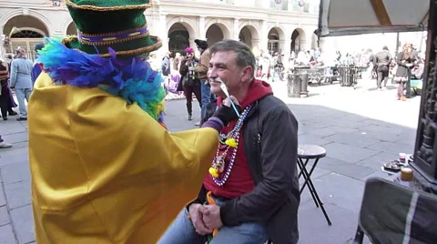 Man gets his face painted during Mardi Gras Stock Footage 52372906
