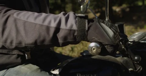 Man gets his motorcycle ready Stock Footage 73006335
