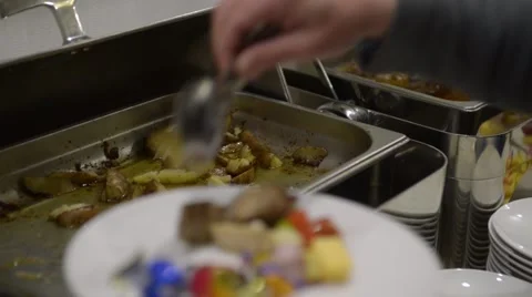 Man gets his plate of meat and potato Stock Footage 48806623