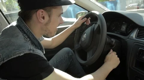Man gets the key and start the car. Stock Footage 51756846