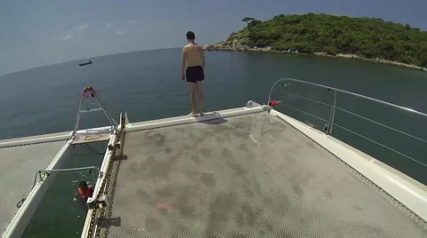 Man gets kicked from the back and falls from the boat to the sea POV Video stock 51212594