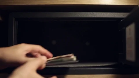 A man gets the money from a safe deposit box Stock Footage 76480642