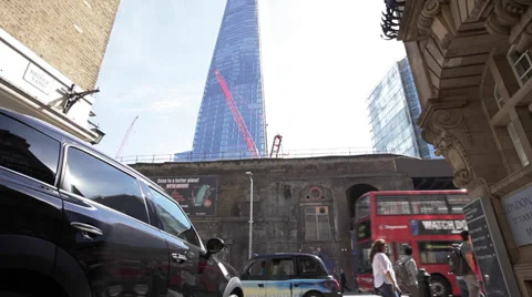 Man Gets Out of Cab, Britain London UK, Mini, Red Bus, Black Taxi Cab, The Shard Stock Footage 39299724