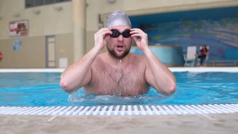 The man gets out of the wate and shows his thumb up Stock Footage 145756908