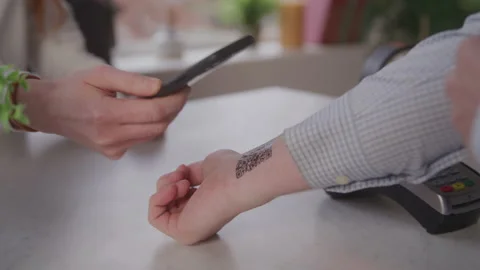 Man Gets QR Code on Inside of His Wrist Scanned by a Smartphone for Transaction Stock Footage 208797872