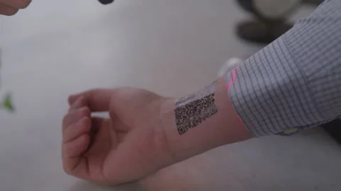 Man Gets QR Code on the Inside of His Wrist Scanned Video stock 208797897
