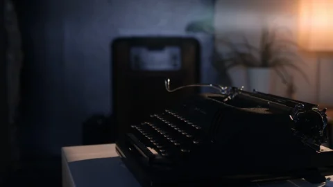 Man gets ready to write on an old dusty vintage typewriter Stock Footage 97763635