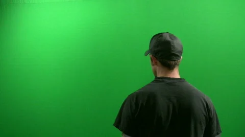 Man Gets Shot by a Gun In Front of a Green Screen Stock Footage