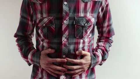 Man gets stomach ache Stock Footage 99770314