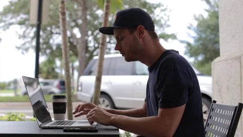 Man Gets Text Message and Responds While Working Stock Footage 76484163