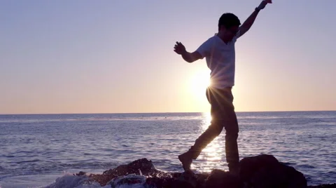 Man Gets Too Close To Waves, Has To Run Further From Shore Stock Footage 47293957