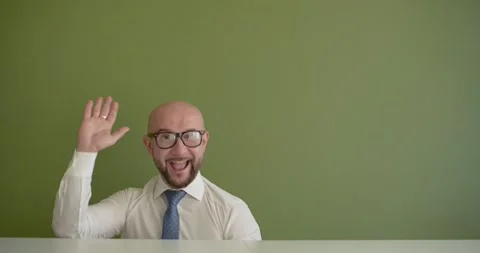 A man gets up from under the table excitedly Stock Footage 267088212
