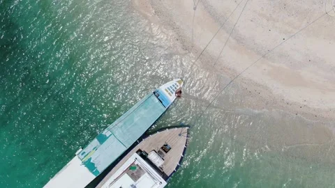Man getting of boat and walking away Stock Footage 303795531