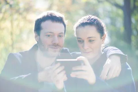 Man getting camera ready for selfie with girlfriend Stock Photos