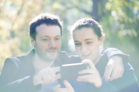 Man getting camera ready for selfie with girlfriend Stock Photos