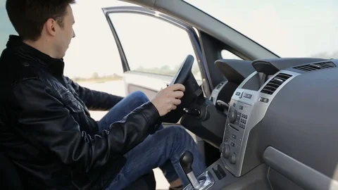 A man getting into a car Stock Footage 73998390