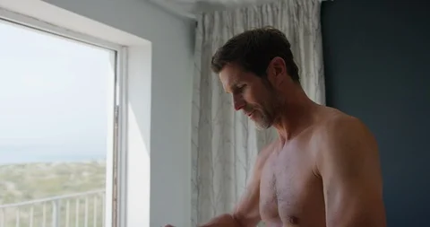 Man getting dressed Stock Footage 129761995