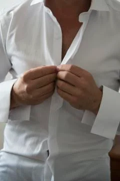 Man getting dressed Stock Photos