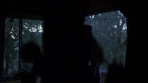 Man Getting Dressed in a window Stock Footage 129907527