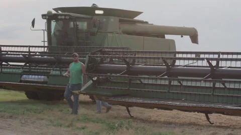 Man Getting Into John Deere Combine Stock Footage 65027527