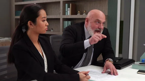 Man getting mad due to signing contract - Pair of angry workers on meeting Stock Footage 247515207