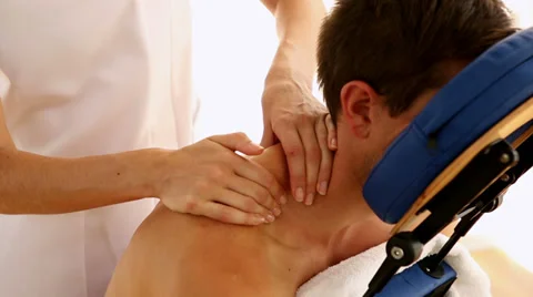 Man getting a massage in a chair Stock Footage