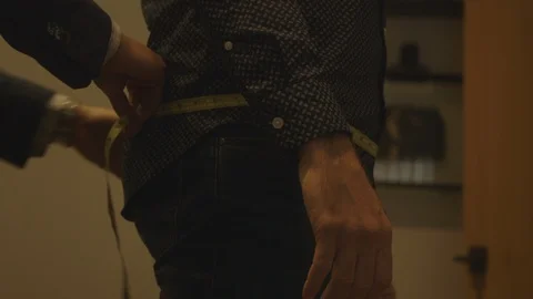 Man Getting Measurements For Suit Fitting Video stock 118095539