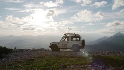 Man getting out of car at mountain top in slow motion Stock Footage 71568946