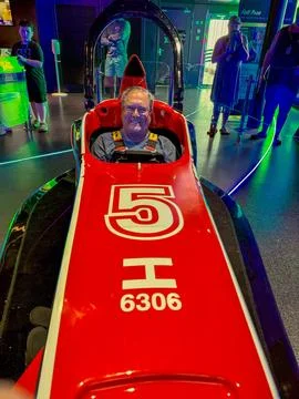 A man getting ready to do Formula 1 simulator aboard the MSC Seashore cruis.. Stock-Fotos