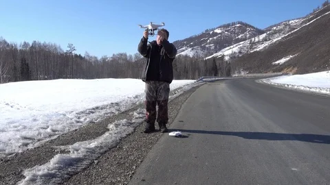 Man getting ready to fly a copter Видео 84840287