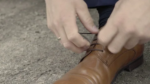 Man getting ready for a wedding, Norway, adjusting his shoe Stock Footage 84207275