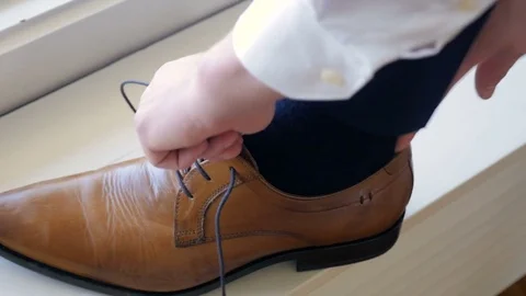 Man getting ready for a wedding, Norway, shoes window Stock Footage 84209668