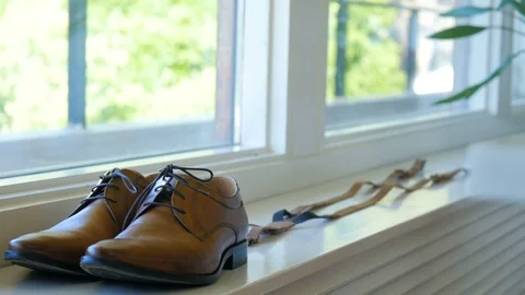 Man getting ready for a wedding, Norway, shoes still Stock Footage 84213060