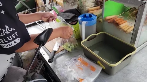 A man is getting ready to work in his street food Thailand Stock-Footage 250395895