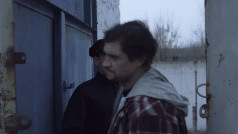 A Man getting released from jail and a policeman Stock Footage 283094098