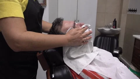 Man getting a shave Stock Footage 141382983