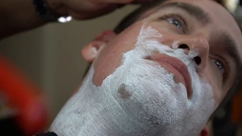 Man Getting Shaved With Straight Razor by Barber Stock Footage 128145020