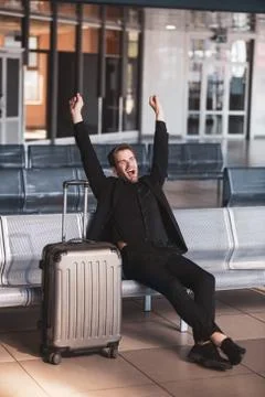 Man getting sleepy while waiting for his flight Stock Photos