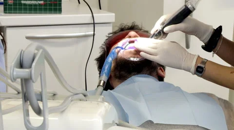 Man getting teeth whitening operation medium shot Stock Footage 45997627