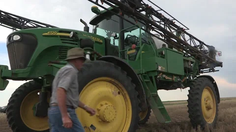 Man getting in tractor 库存影片 34207518